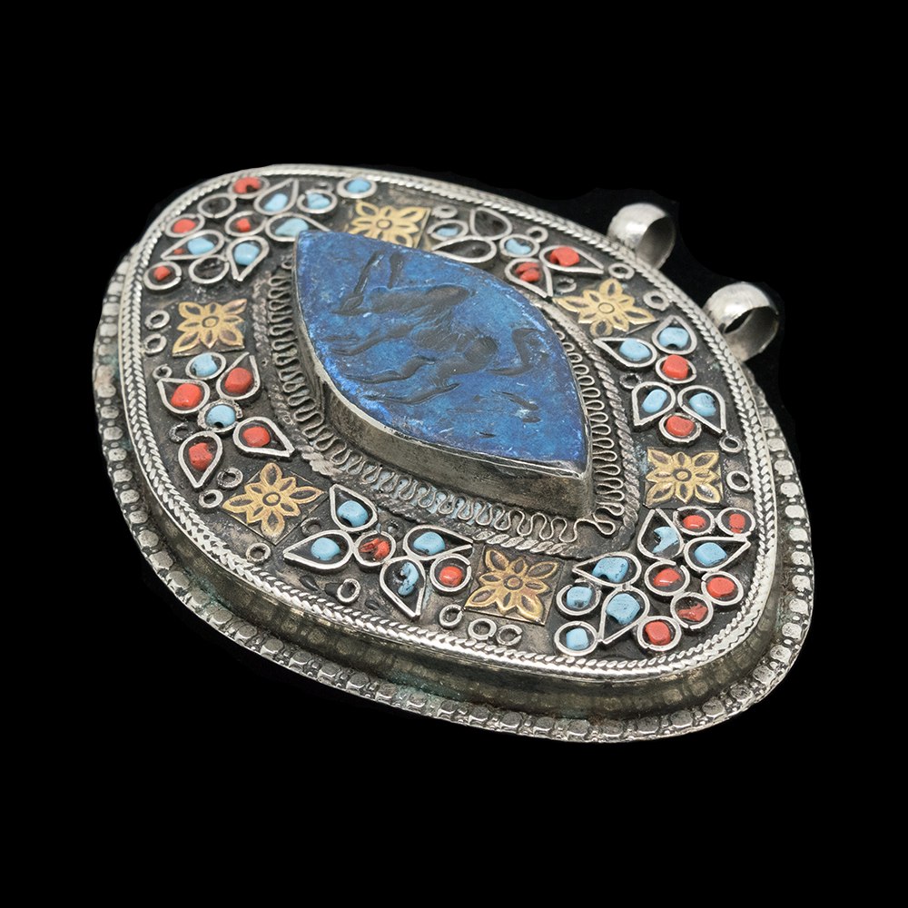 Vintage Turkmen pendant with imprint of an antelope
